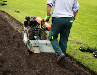 A professional gardener working on a customers garden